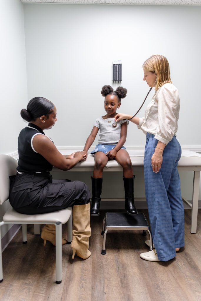 clinician meeting with mother and daughter