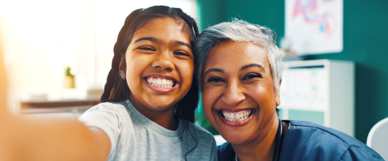 child and mother smiling selfie