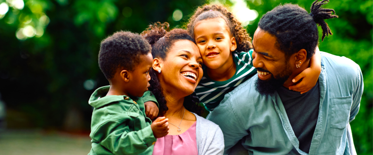 smiling family with two kids